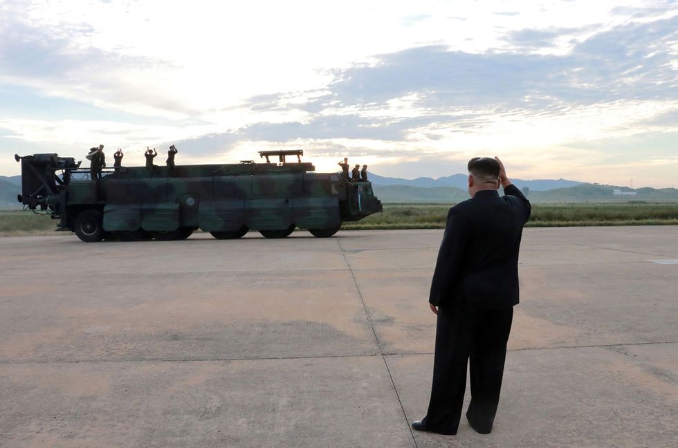 north korea kim jong un waving to military members