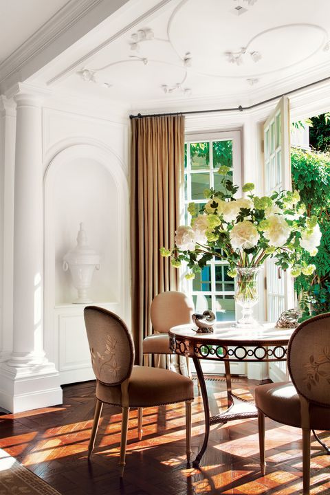 White plaster dining room with dogwood flower detail