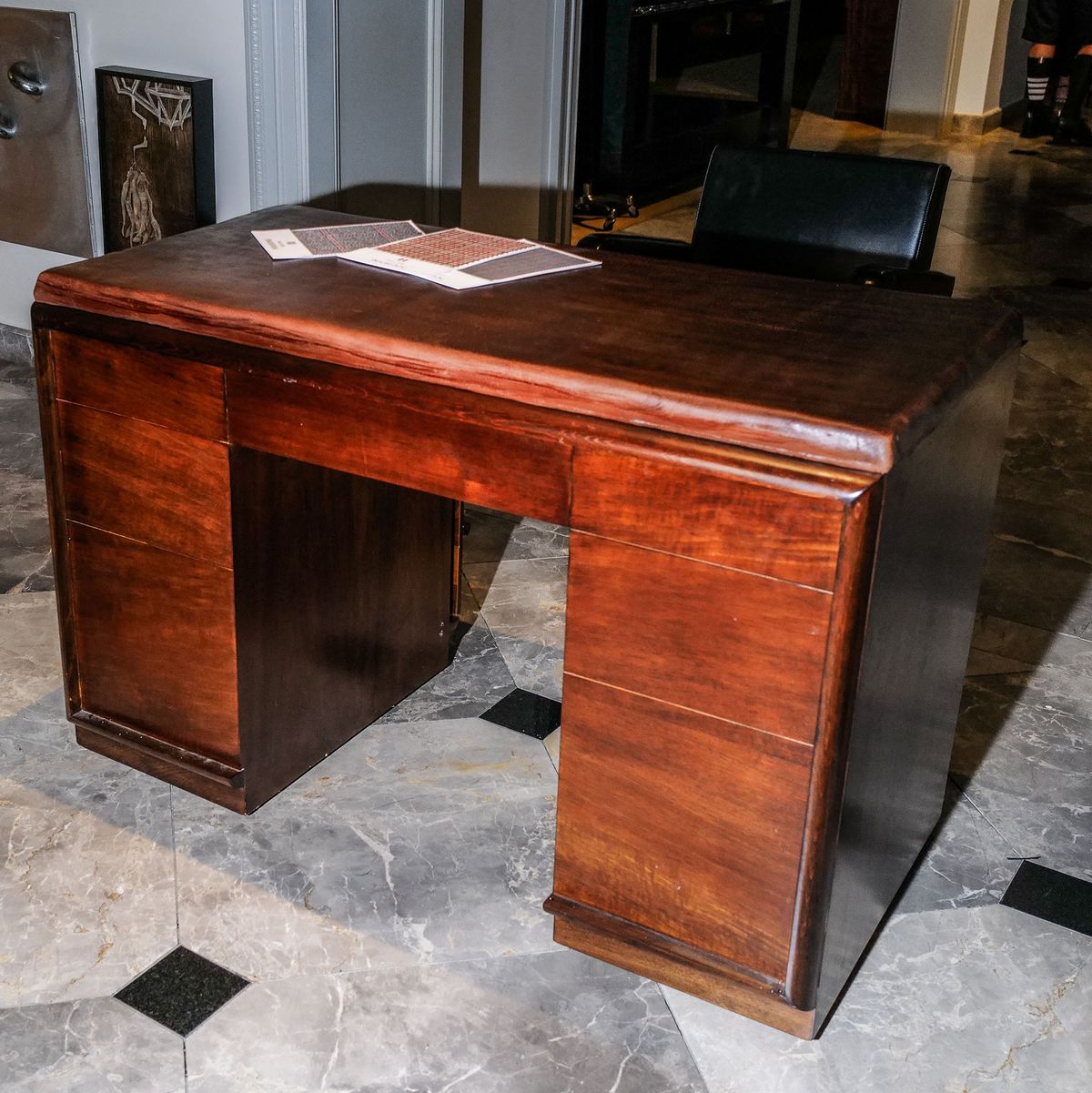 a wooden desk in a room