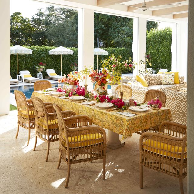 a radiant florida lanai with canvas seat cushions in sunshine yellow dress wicker porch seating