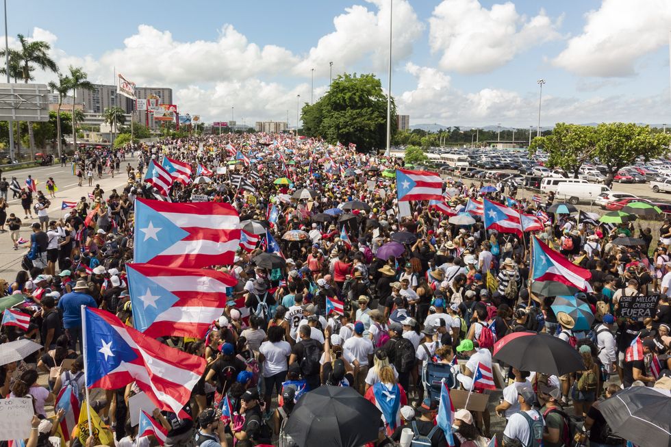 Thousand of protestors block a main highway during the demonstration to demand the resignation of Puerto Rico's Governor Ricardo Rossello on July 22, 2019 in San Juan, Puerto Rico.