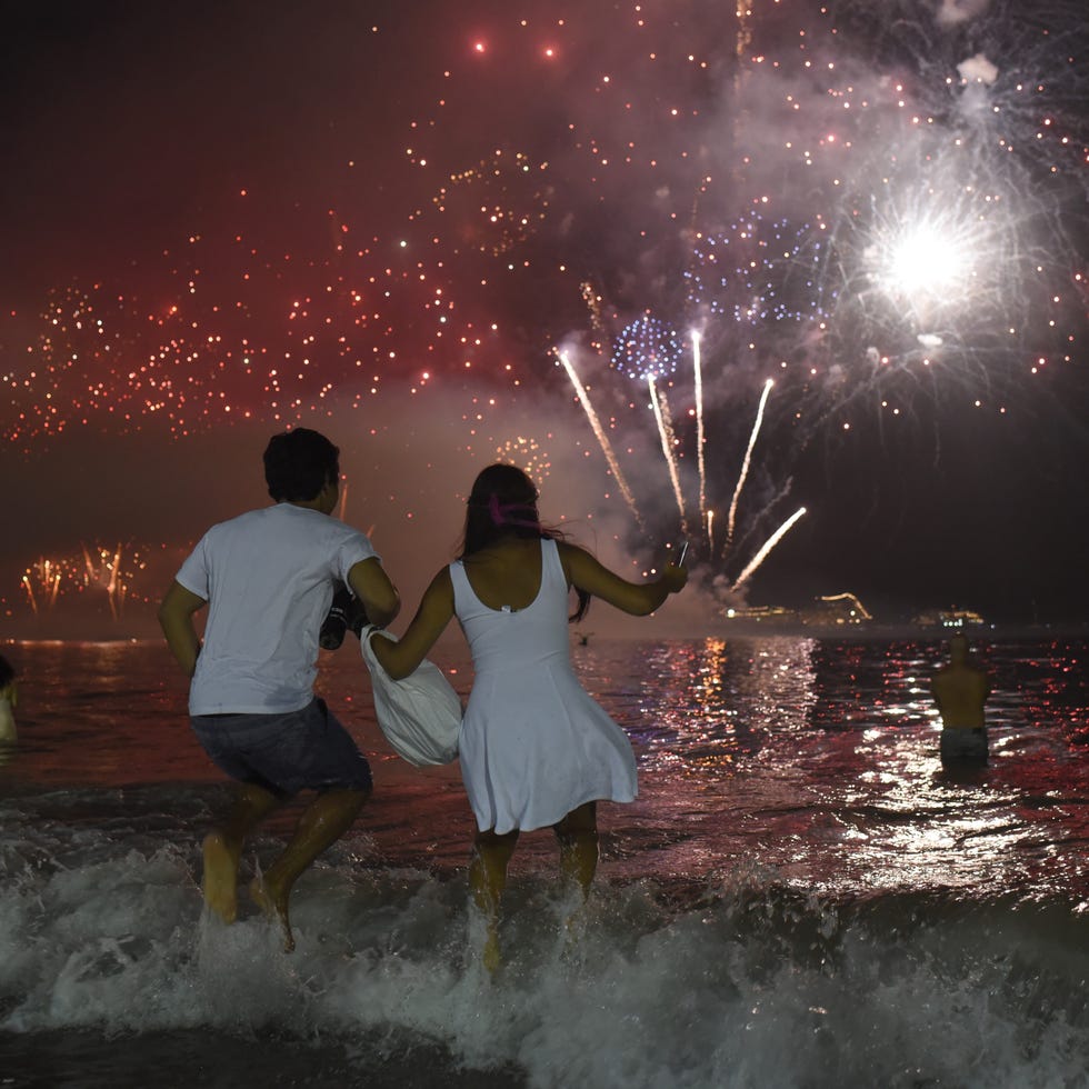 new year's eve good luck traditions   wear white and jump over seven waves