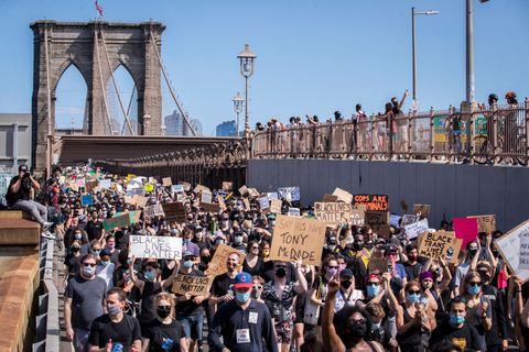 thousands of protesters walk in a peaceful protest across the brooklyn bridge on june 19, 2020
