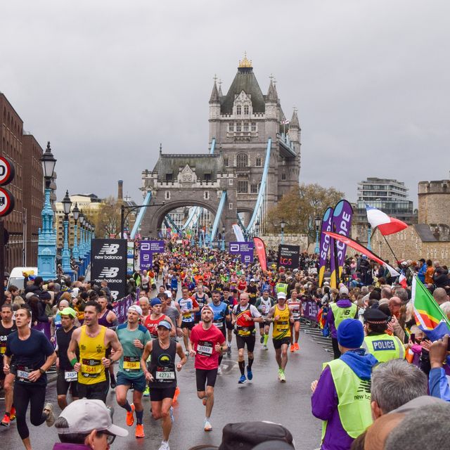 thousands of runners pass across tower bridge during london