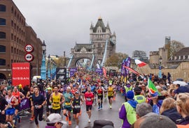 thousands of runners pass across tower bridge during london