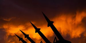 threat of nuclear war missile system on the background of sunset sky