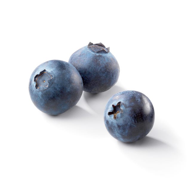 ثلاث حبات عنبية على خلفية بيضاء Three blueberries on a white background
