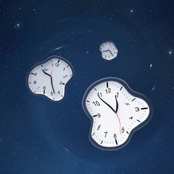 three clocks that are warped against a starry blue background
