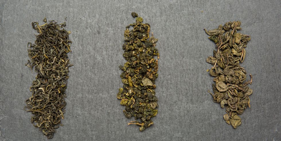 three varieties of green tea on  dark background