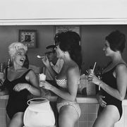 women wearing bikinis in ice cream parlor