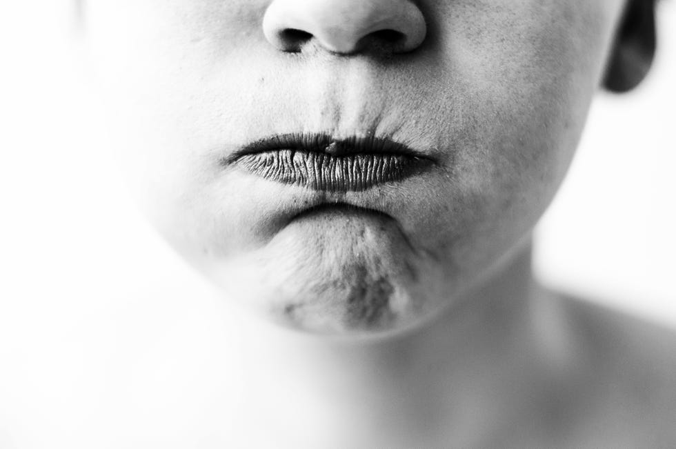 Close-Up Of Person Making Face
