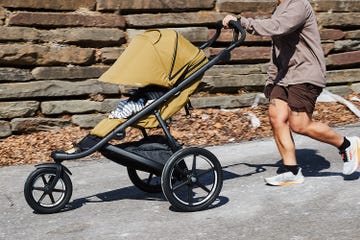 a person running with a jogging stroller