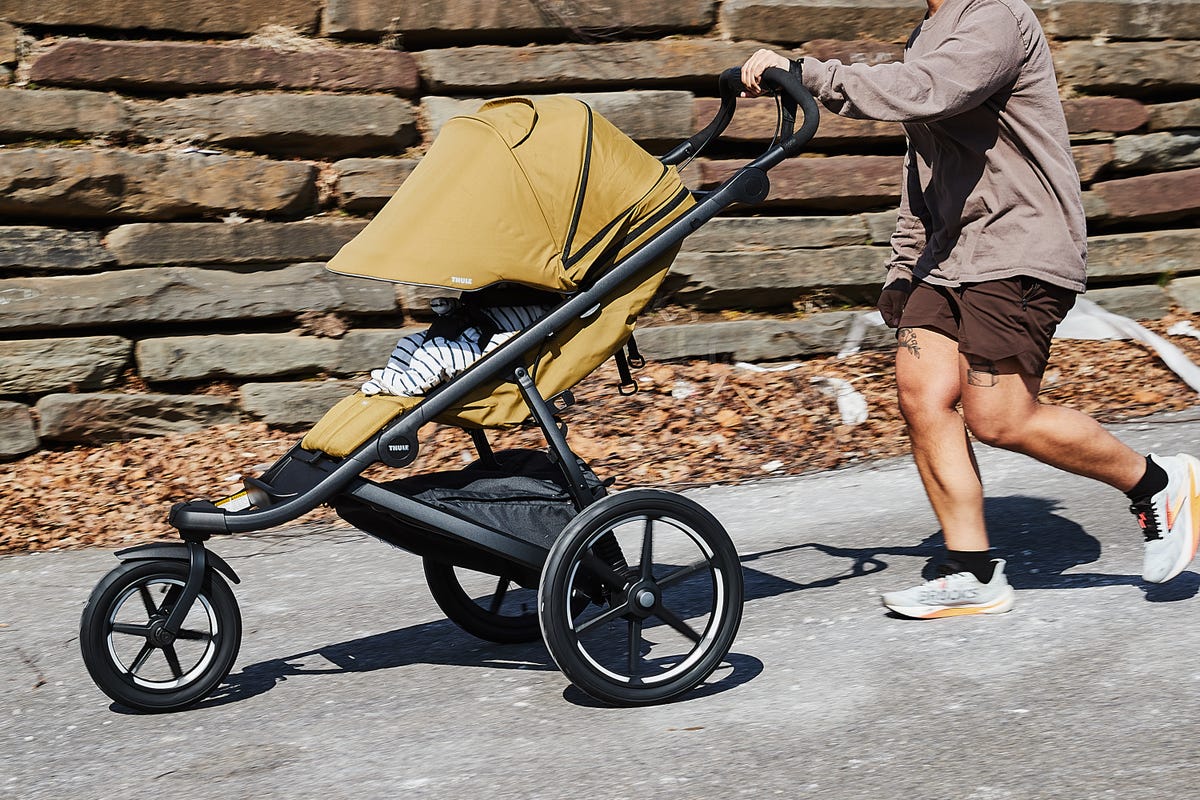 a person running with a jogging stroller