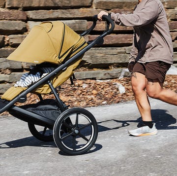 a person running with a jogging stroller a person running with a jogging stroller