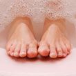 diabetics can have cracked feet; woman soaking feet