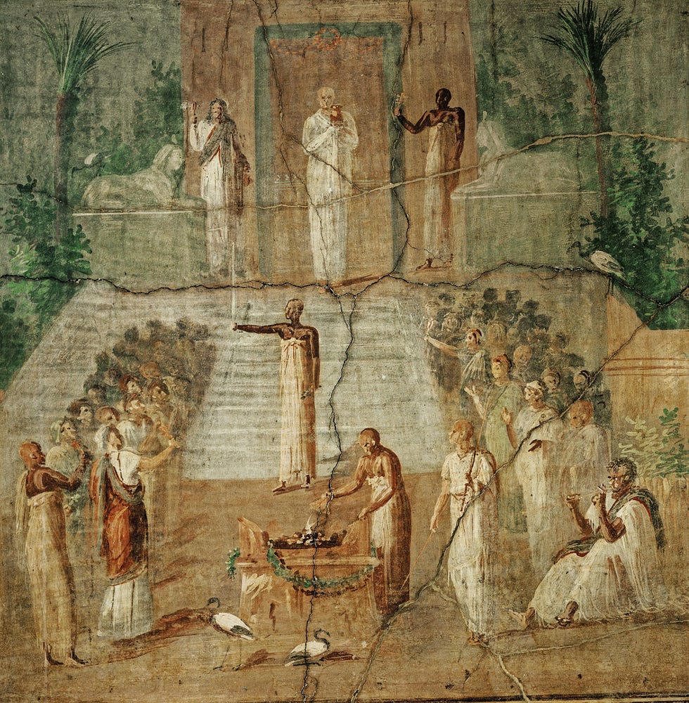 Dit fresco uit Hercula neum toont een ceremonie uit de Isiscultus De hogepriester komt uit de tempel naar buiten met een Osiriscanope in zijn handen een vaas met het hoofd van deze godheid die heilig water uit de Nijl bevat Links beschermt de godin een farao met haar uitgespreide vleugels Museo Archeologico Nazionale Napels