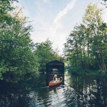 a person in a boat on a river