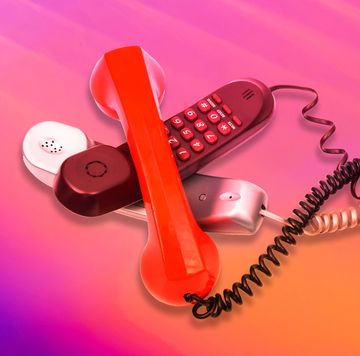 a red telephone with a cord