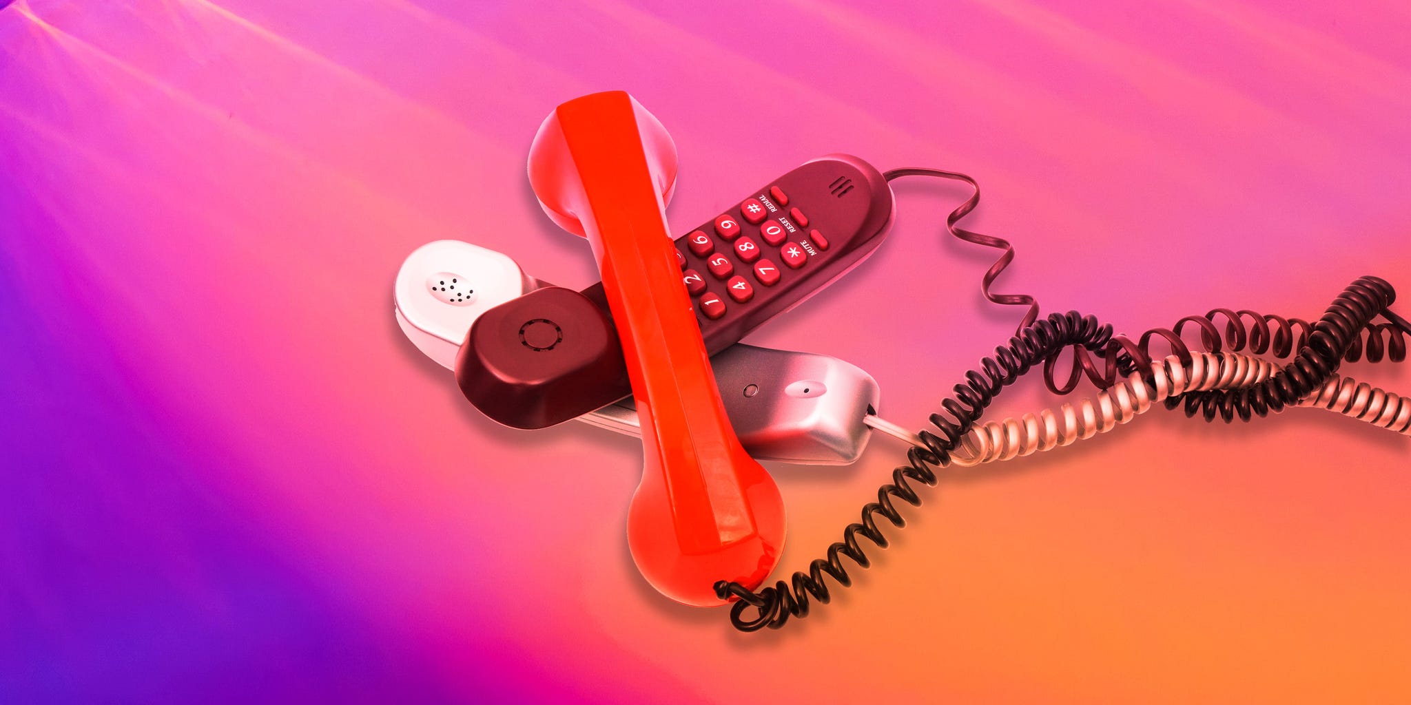 a red telephone with a cord