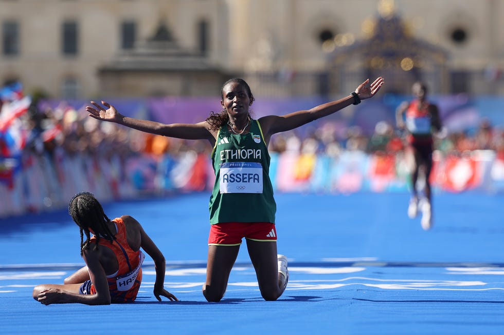 Paris, France, August 11: Tigst Assefa of Team Ethiopia reacts after crossing the finish line in second place during the Women's Marathon on Day 16 of the Paris 2024 Olympic Games at the Esplanade des Invalides on August 11, 2024 in Paris, France. Photo: Cameron SpencerGetty Images