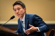 tiktok ceo shou zi chew gesturing while speaking into a microphone
