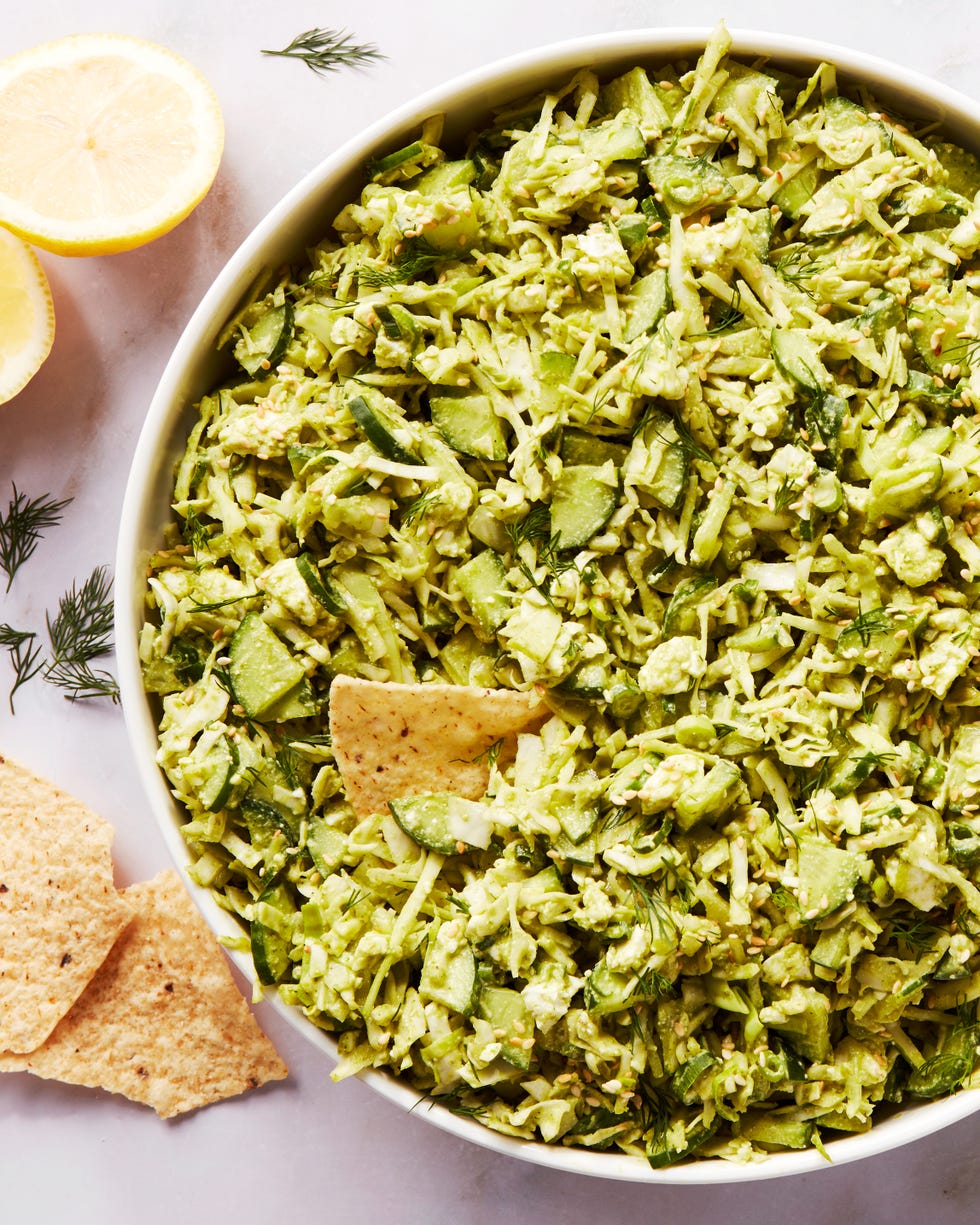 finely chopped green vegetables in a bowl with tortilla chips