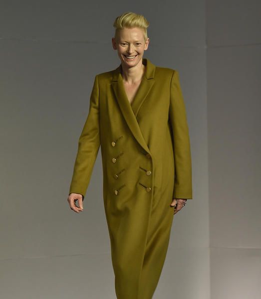 Clothing, Suit, Outerwear, Overcoat, Yellow, Coat, Fashion, Formal wear, Sleeve, Duster, 