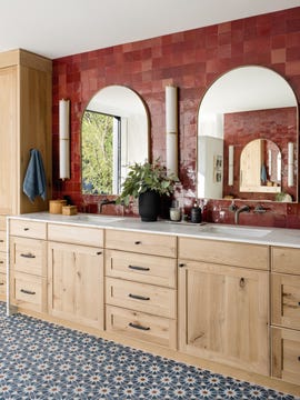 bathroom with red tiled wall