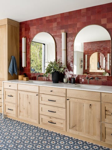 bathroom with red tiled wall