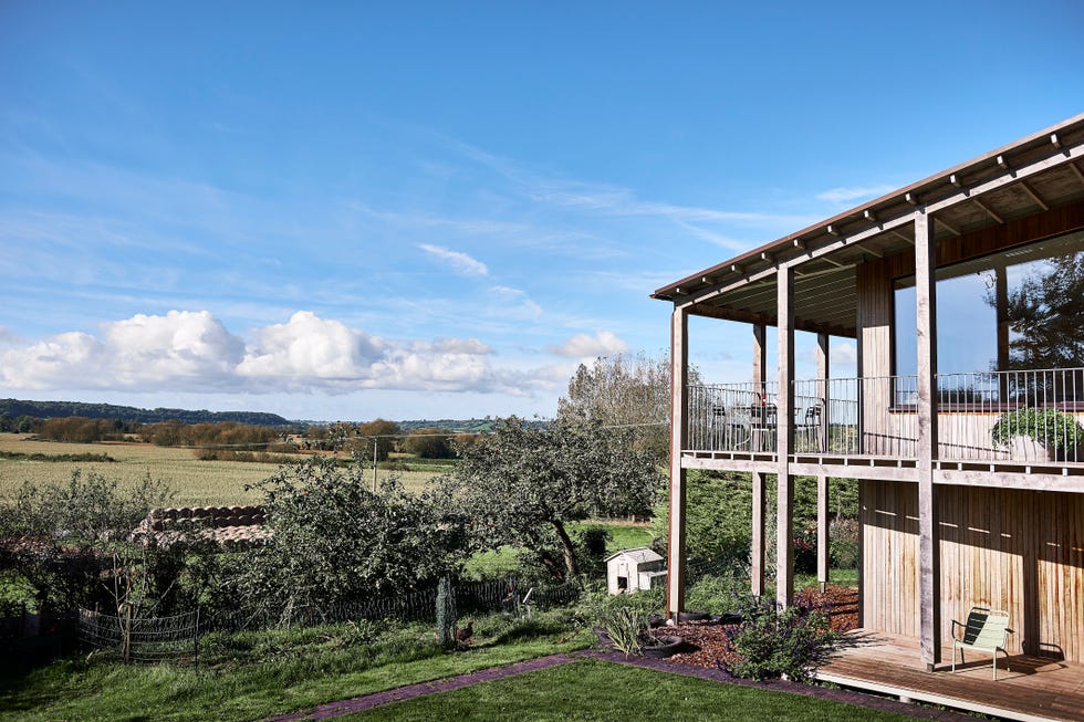 exterior of timber clad new build eco home in the middle of the countryside