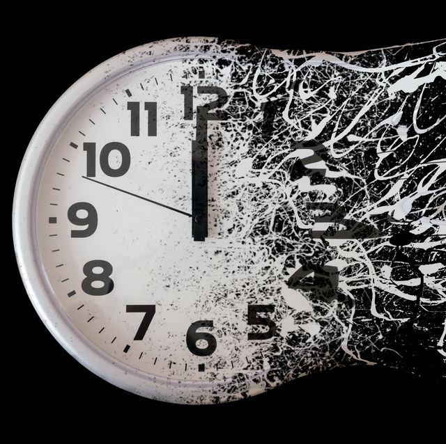 time is running out concept shows clock that is dissolving away into little particles black and white wall clock