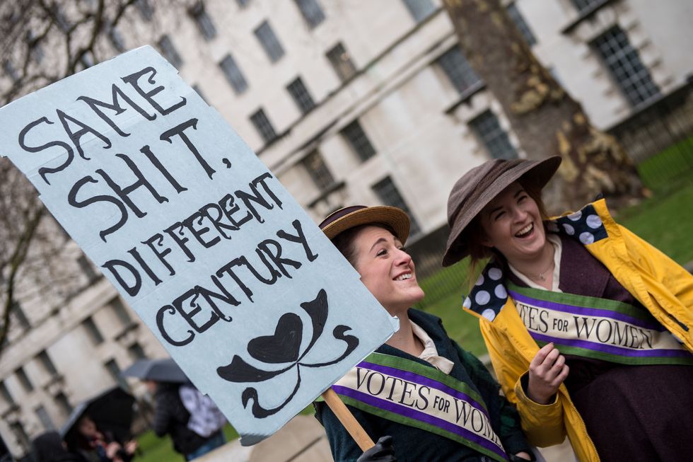 london, england   january 21  a women's rights demonstrators dressed as suffragettes during the time's up rally at richmond terrace, opposite downing street on january 21, 2018 in london, england the time's up women's march marks the one year anniversary of the first women's march in london and in 2018 it is inspired by the time's up movement against sexual abuse the time's up initiative was launched at the start of january 2018 as a response to the metoo movement and the harvey weinstein scandal  photo by chris j ratcliffegetty images
