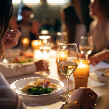 woman eating at a dinner party