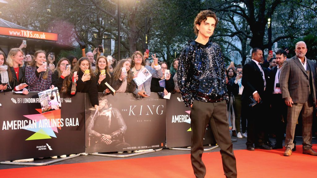 Timothée Chalamet Wears a Sequined Hoodie to The King UK Premiere