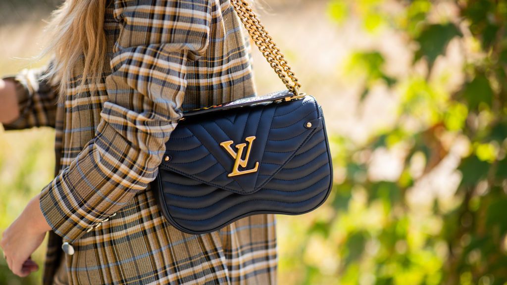 Download A Collage Of Various Louis Vuitton Bags Wallpaper