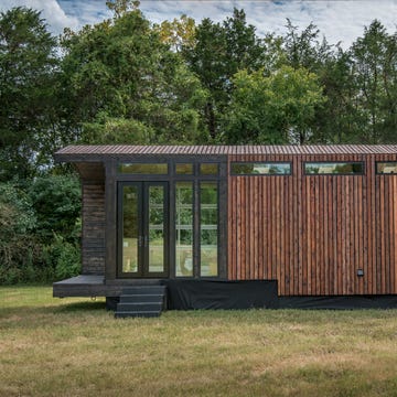 This Tiny Home Comes With a Greenhouse and Porch Swing