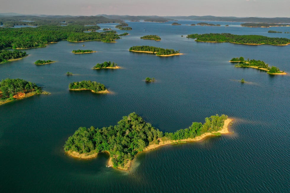 tiny islands dot the coastline of lake ouachita, ak