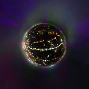 a tiny planet aerial view of the northern lights aurora borealis over ipswich in suffolk, uk