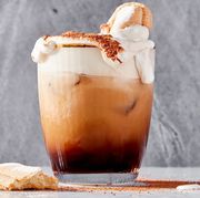 tiramisu white russian cocktail topped with whipped cream and a ladyfinger cookie