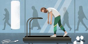 Business people walking behind tired man on treadmill