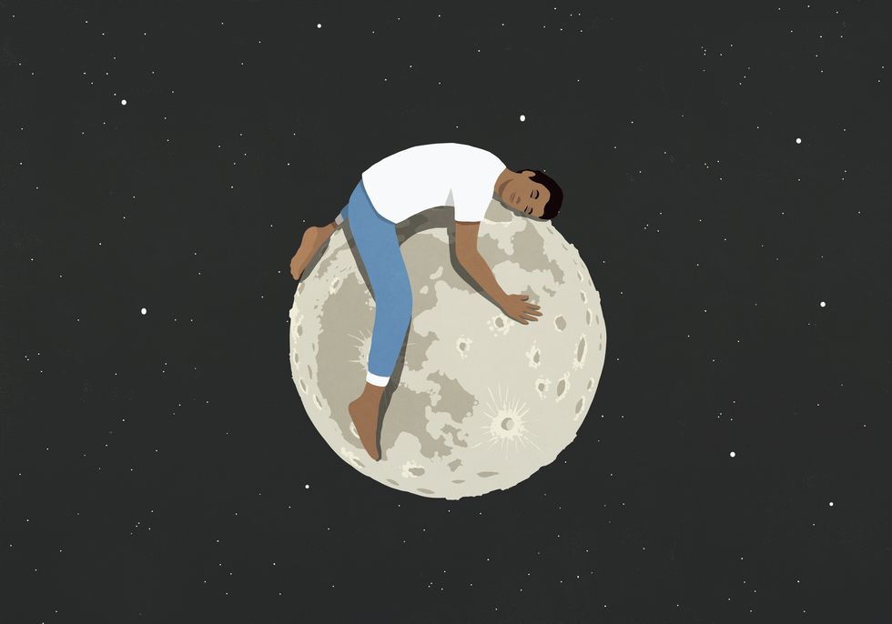 tired man sleeping on top of the moon