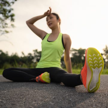Tired woman runner taking a rest after running hard in the park. Sweating fitness woman tired exausted of running in sun heat dehydrated with sweat dripping from face. Athlete jogger jogging outside in city. tired woman runner taking a rest after running hard in the park sweating fitness woman tired exausted of running in sun heat dehydrated with sweat dripping from face athlete jogger jogging outside in city