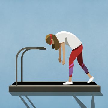tired woman walking on treadmill