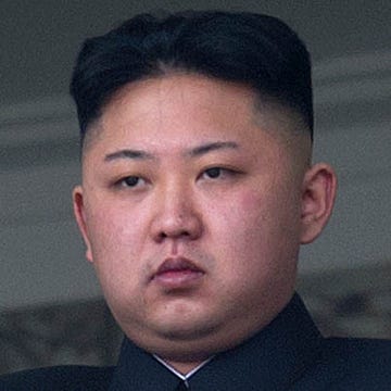 TO GO WITH Oly-2012-PRK,FEATURE(FILES) This file photo taken on April 15, 2012 shows North Korean leader Kim Jong-Un saluting as he watches a military parade to mark 100 years since the birth of the country's founder and his grandfather, Kim Il-Sung, in Pyongyang. He lacks the toned physique of an Olympian but 'dear respected' leader Kim Jong-Un will be the inspiration when North Korea's athletes go for gold at the London Olympics.  North Korea are aiming for a record number of medals in London in what would be a timely boost for Kim, the new face of the country's ruling dynasty and its all-pervasive personality cult.      AFP PHOTO / FILES / Ed Jones