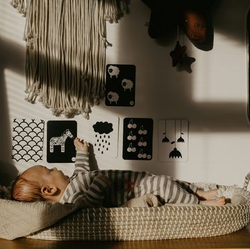 a baby lying on a bed