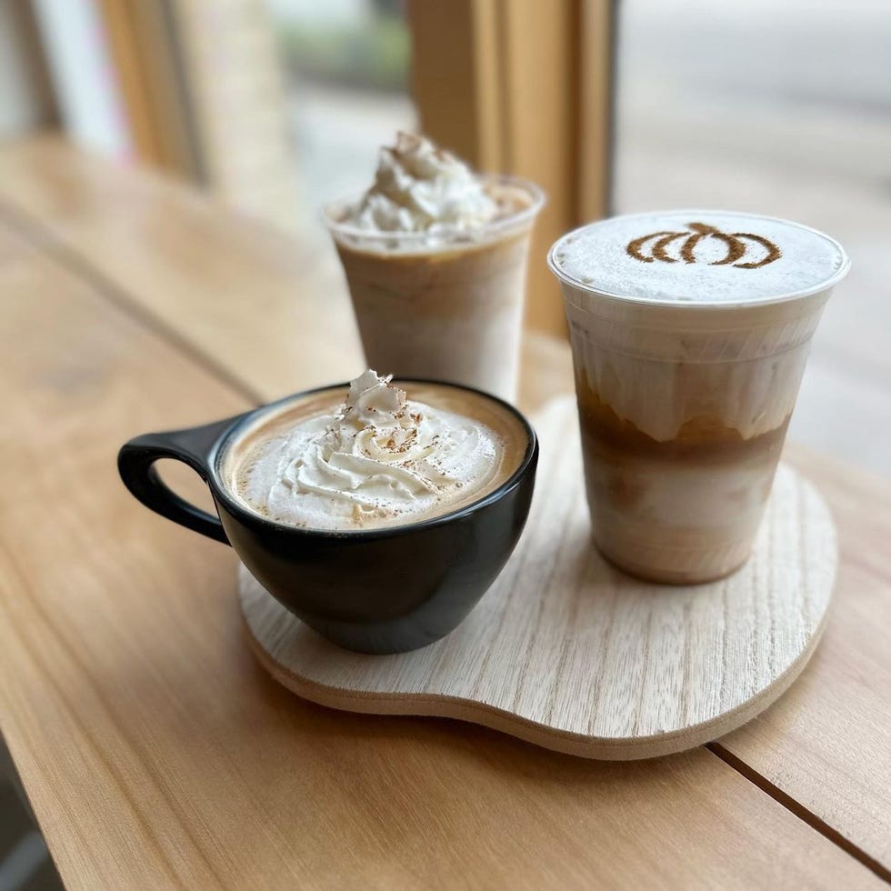 a cup of coffee and a cup of coffee on a table