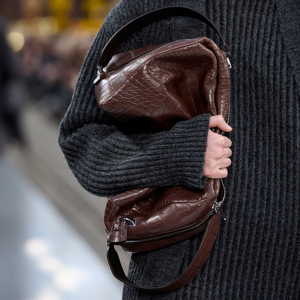 a person holding a purse