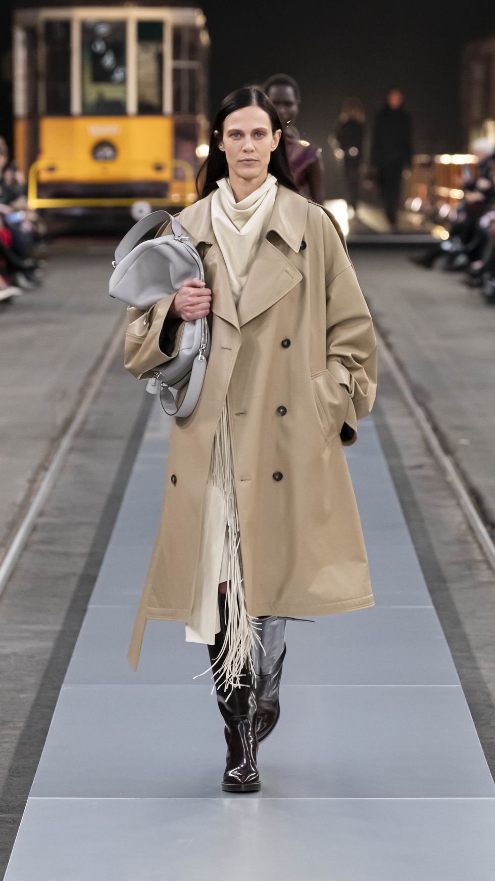a person in a trench coat