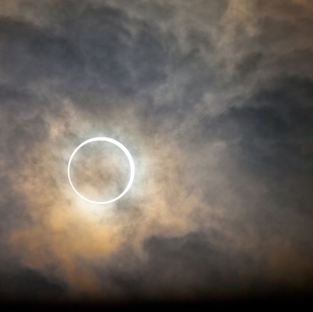 a total solar eclipse with clouds