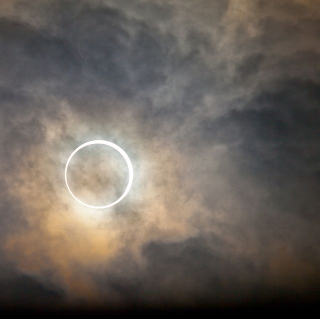 a total solar eclipse with clouds